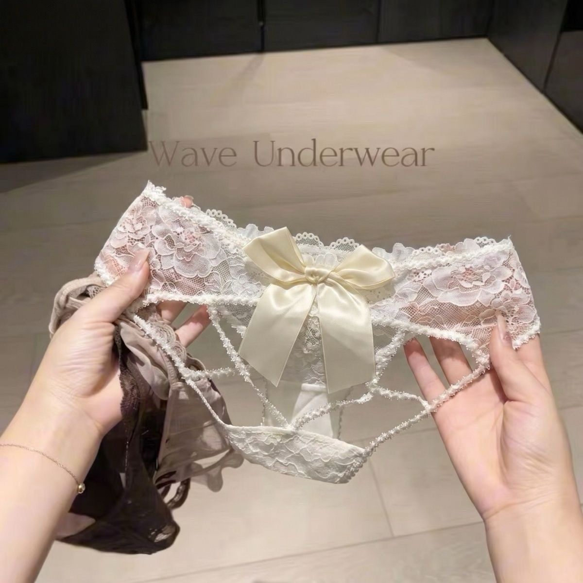 Detail view of Bow-Detail Cutout Lace Bikini Panty